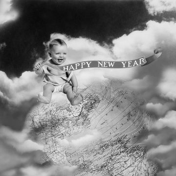 1930s montage baby sitting on top of the world earth globe in clouds holding happy new year banner  photo by h armstrong robertsclassicstockgetty images