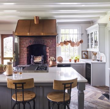 white and gray kitchen, copper hood, fireplace, beekman 1802