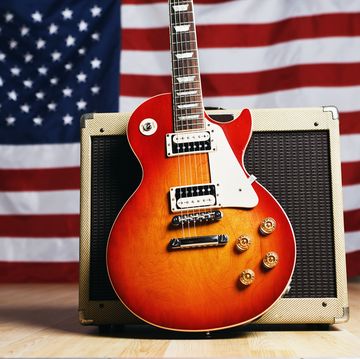 guitar propped up against american flag