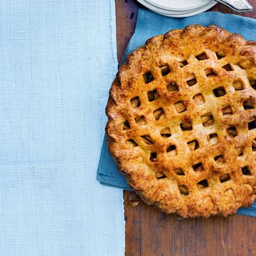 cheddar apple pie on a blue cloth on a table