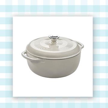 lodge enameled cast iron dutch oven in white and three pom pom hats