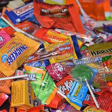 detroit, michigan, usa   october 31, 2016 large pile of mixed commercial candy from trick or treating on halloween night
