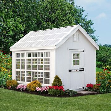 white garden shed with large windows and dutch door